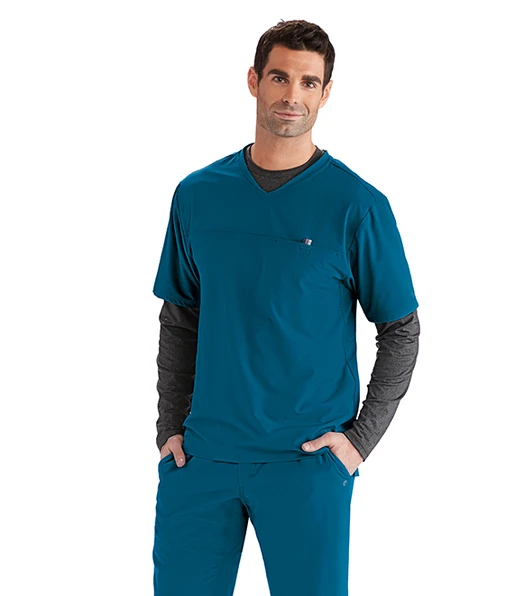 Zdravotnícke oblečenie - Novinky - Pánska zdravotnícka blúza BARCO WELLNESS TOMMY - karibská modrá | medical-uniforms
